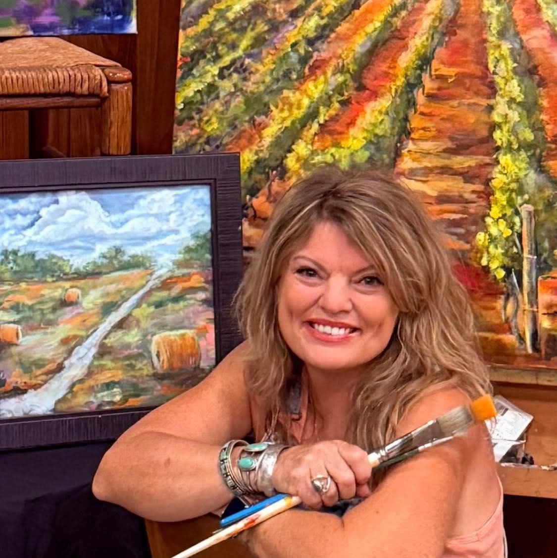 Georgia Duke painting in her studio